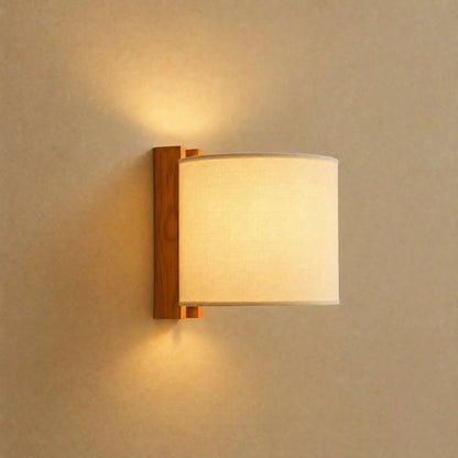 Blyne solid wood wall light, Drum model with ecru fabric shade | Wickleigh