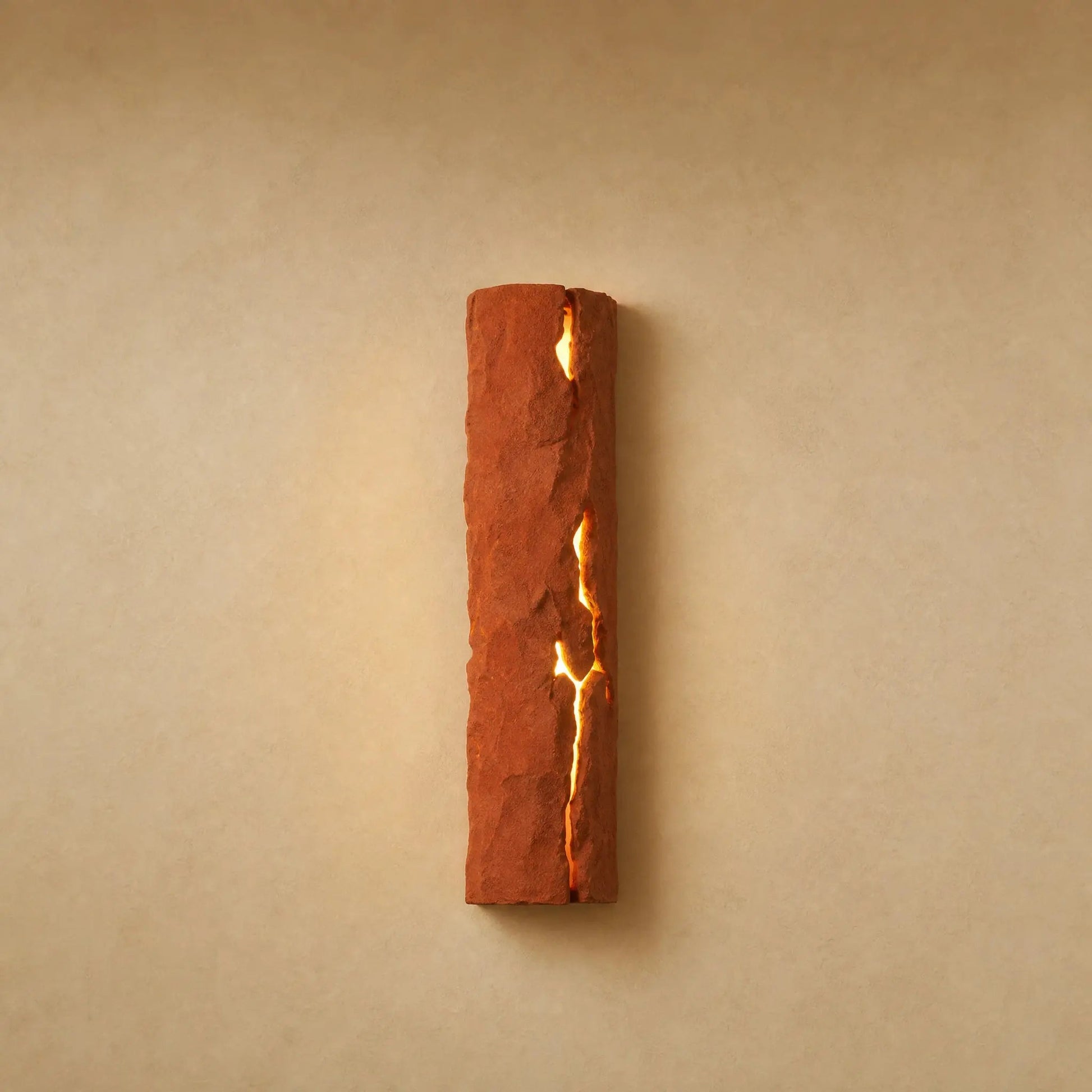 Brevna lava stone effect wall light with luminous fissure, Terracotta finish | Wickleigh