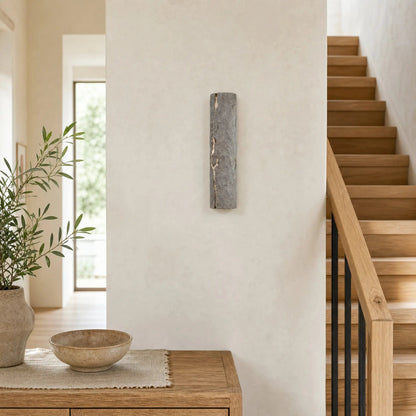 Brevna stone grey wall light in a hallway with an oak staircase | Wickleigh