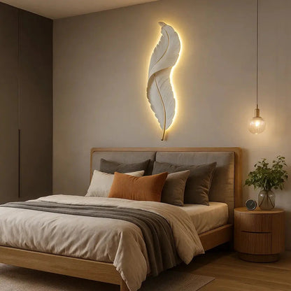 Cavlen feather wall light, gold-edged resin silhouette | Wickleigh