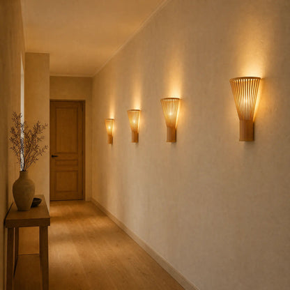 Row of Edlin bamboo wall lights lit along a hallway | Wickleigh