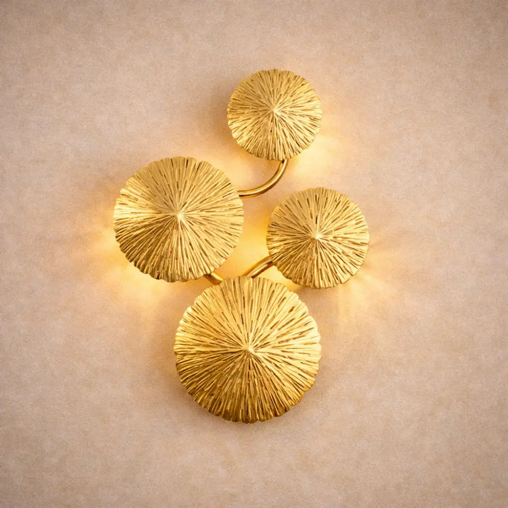 Alova wall light, gilded stainless steel lotus leaves | Wickleigh