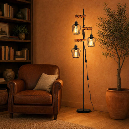 Telna industrial floor lamp, 3 heads, lit in a sitting room with a cognac leather armchair | Wickleigh