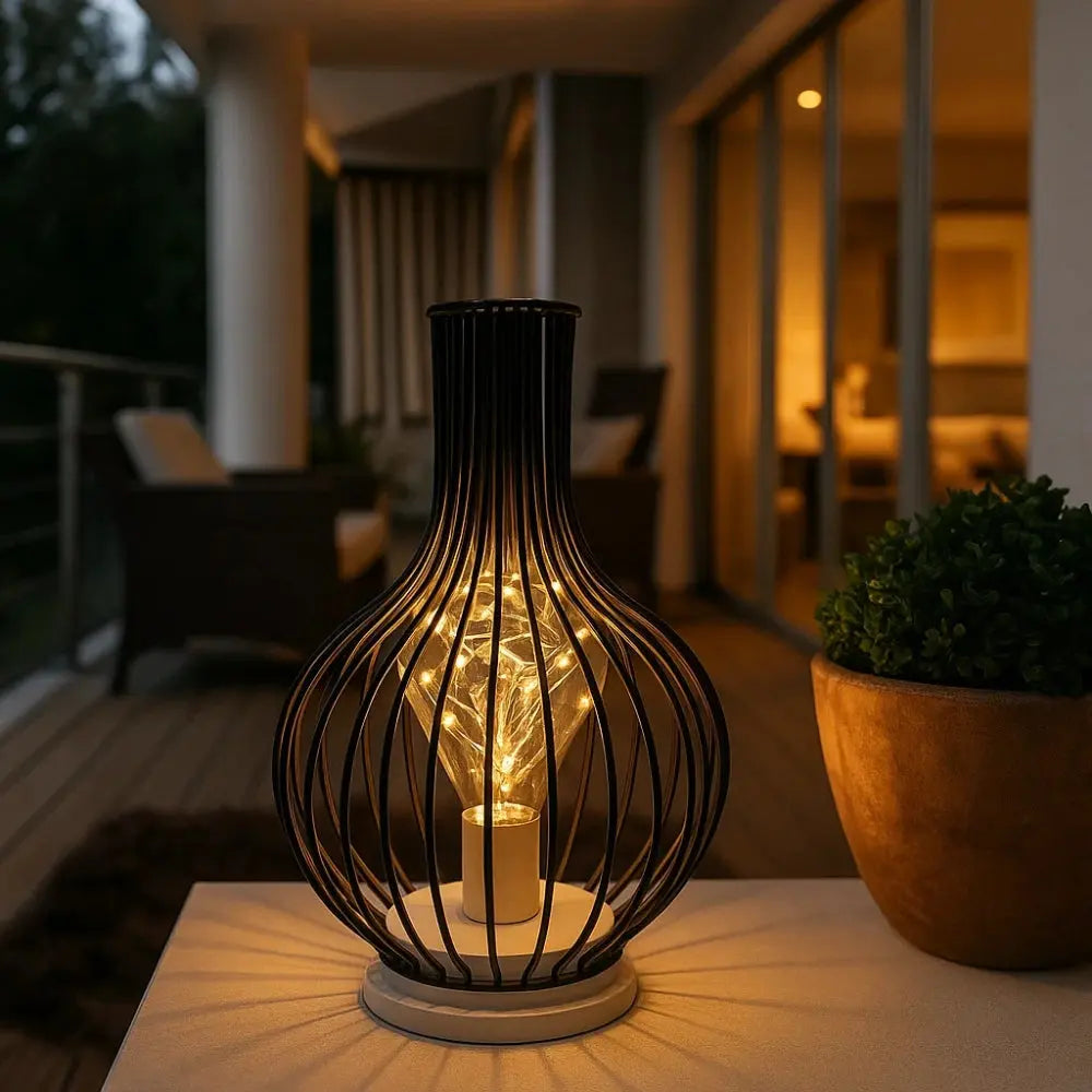 Ylova wrought iron lamp, sculptural design, packshot | Wickleigh