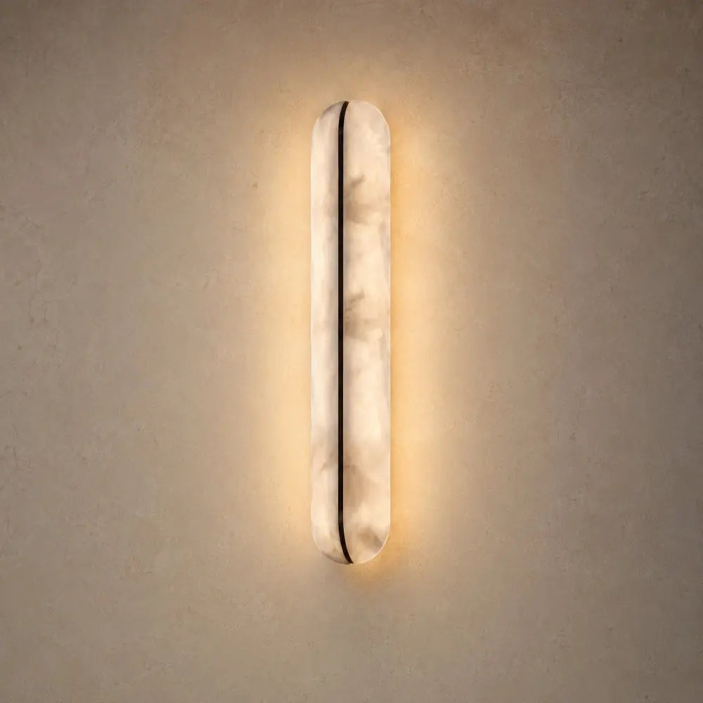 Welna wall light, vertical marble-effect column | Wickleigh