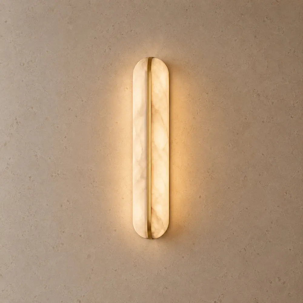 Welna wall light, vertical marble-effect column | Wickleigh