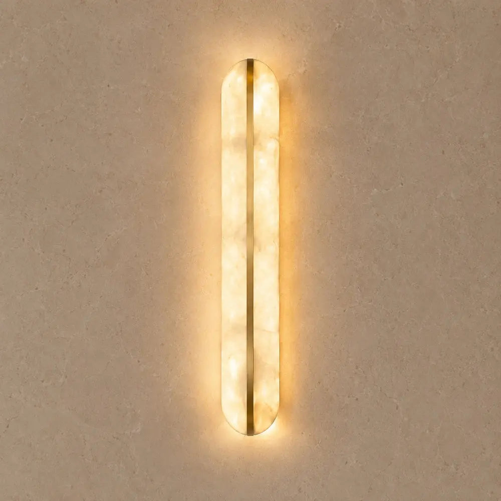 Welna wall light, vertical marble-effect column | Wickleigh