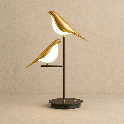 Erlin sculptural gold bird desk lamp, natural light setting | Wickleigh