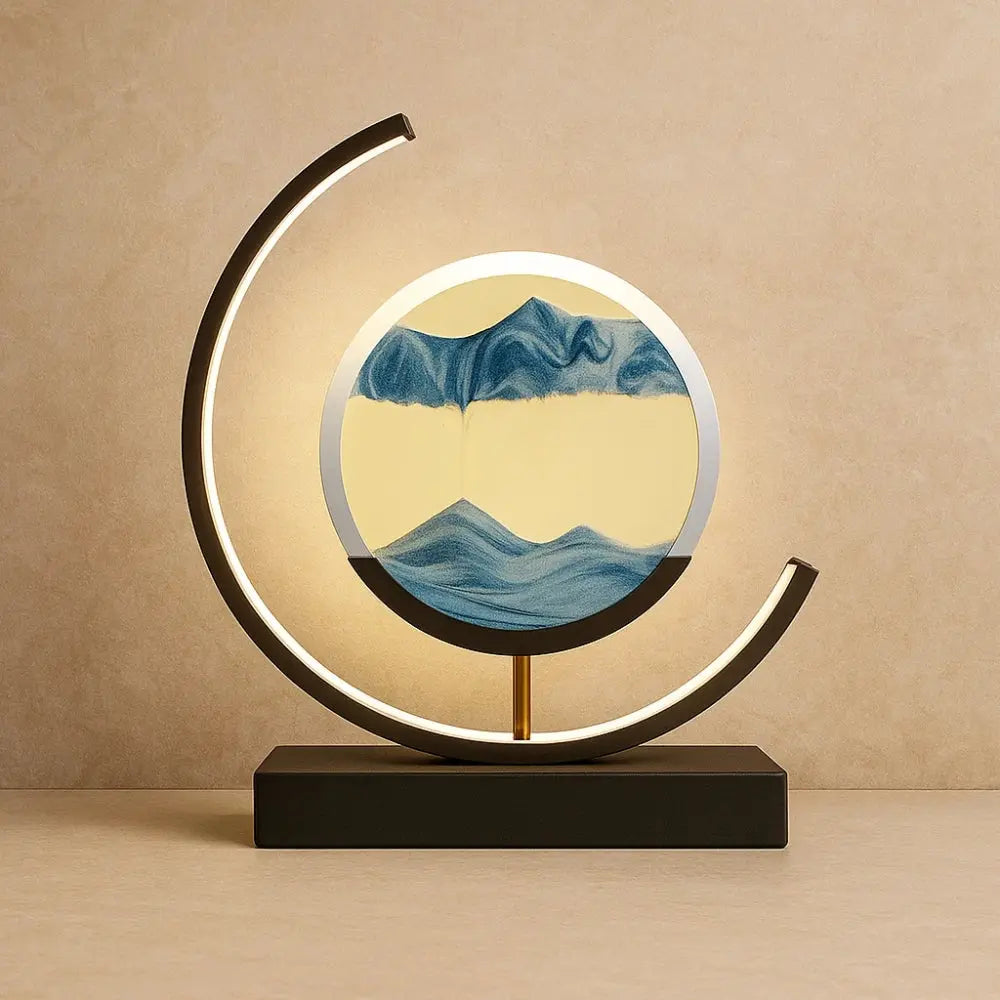 Rilva moving sand art desk lamp, black frame with blue sand | Wickleigh