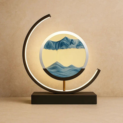 Rilva moving sand art desk lamp, black frame with blue sand | Wickleigh