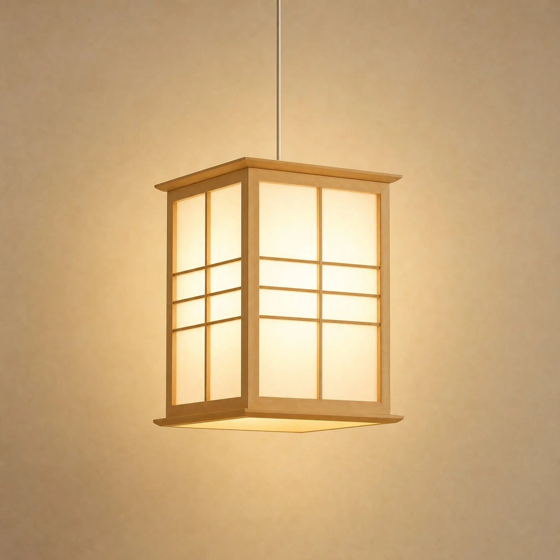 Norla Japanese pendant light in solid pine, shoji-style panels, on a beige mineral backdrop | Wickleigh