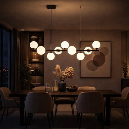 Odvin linear pendant light, glass globe row above dining table, packshot | Wickleigh