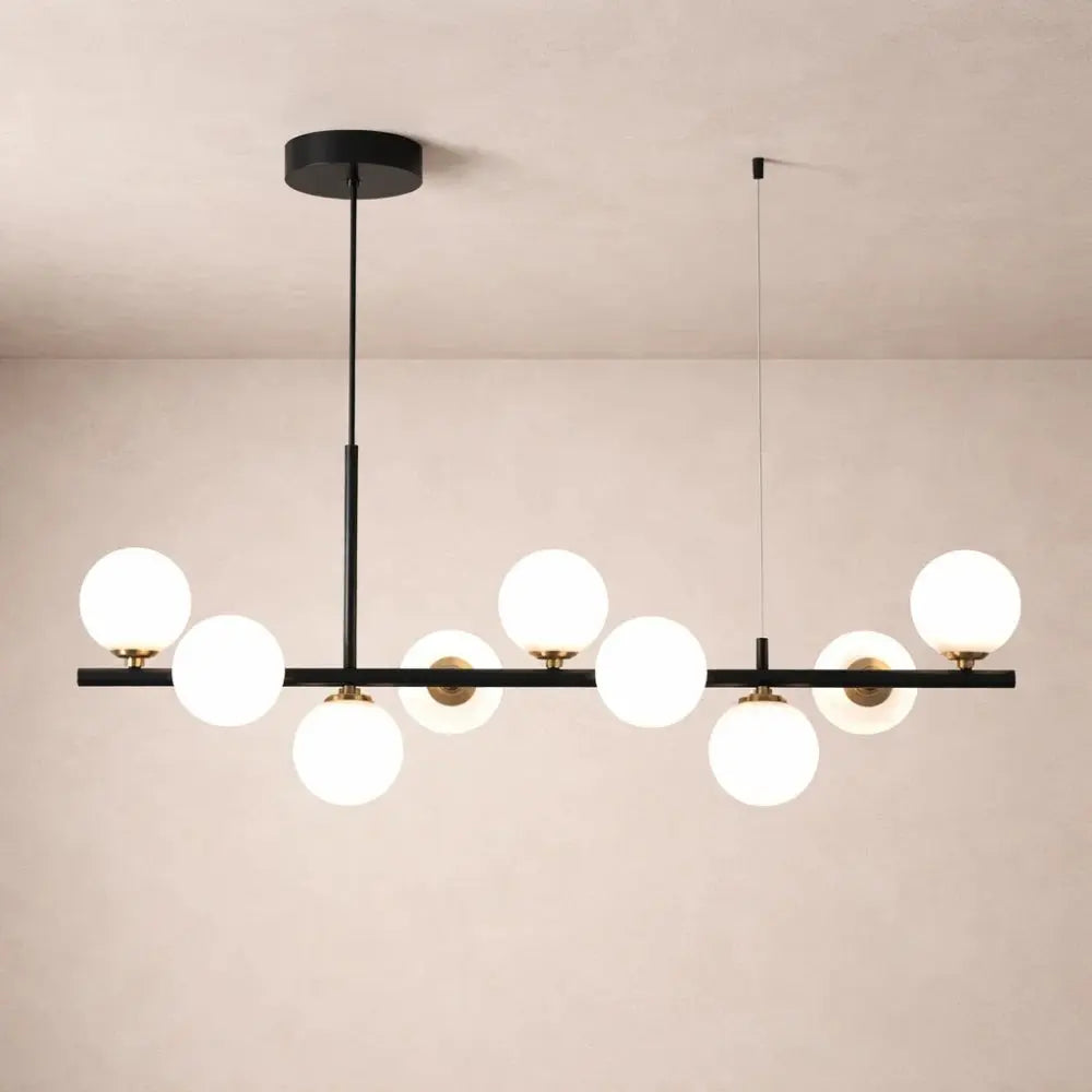 Odvin linear pendant light, glass globe row above dining table, packshot | Wickleigh