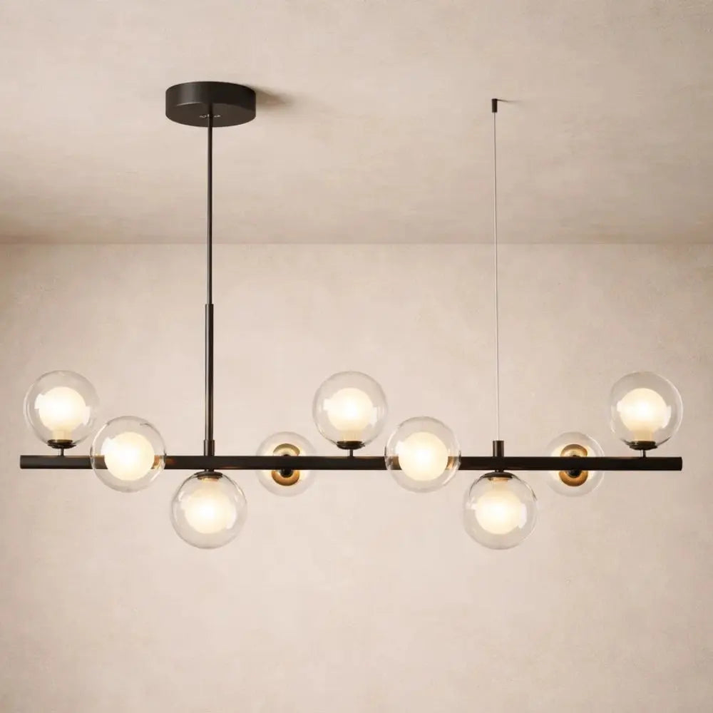 Odvin linear pendant light, glass globe row above dining table, packshot | Wickleigh