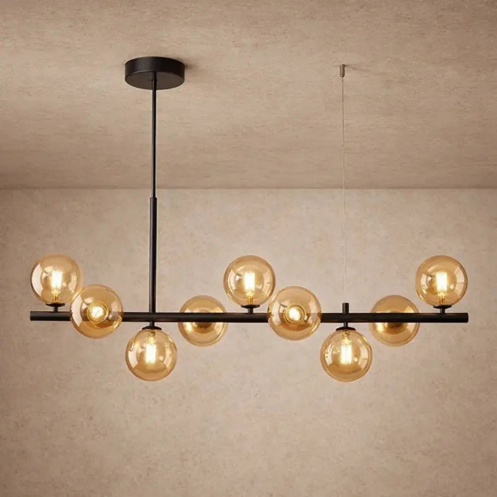 Odvin linear pendant light, glass globe row above dining table, packshot | Wickleigh