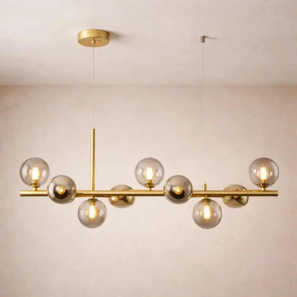 Odvin linear pendant light, glass globe row above dining table, packshot | Wickleigh