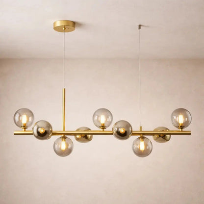 Odvin linear pendant light, glass globe row above dining table, packshot | Wickleigh