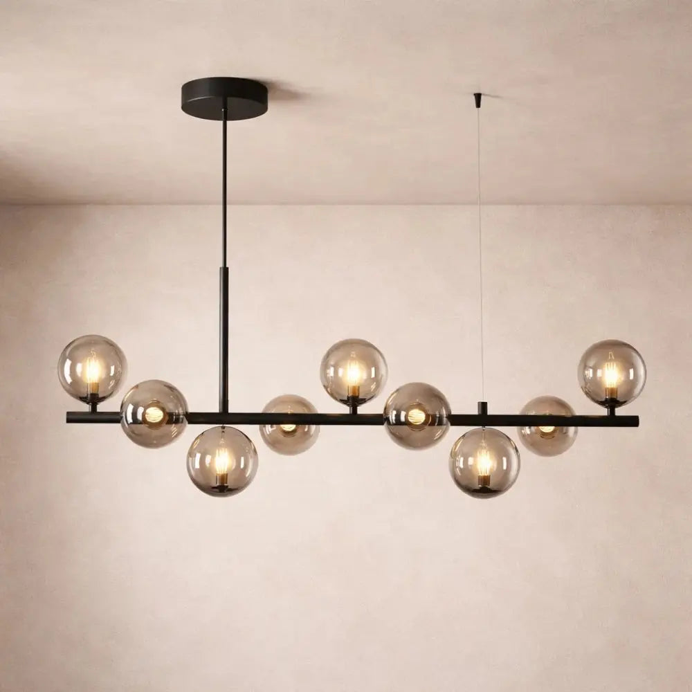 Odvin linear pendant light, glass globe row above dining table, packshot | Wickleigh