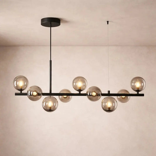 Odvin linear pendant light, glass globe row above dining table, packshot | Wickleigh