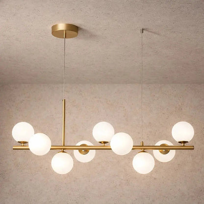 Odvin linear pendant light, glass globe row above dining table, packshot | Wickleigh