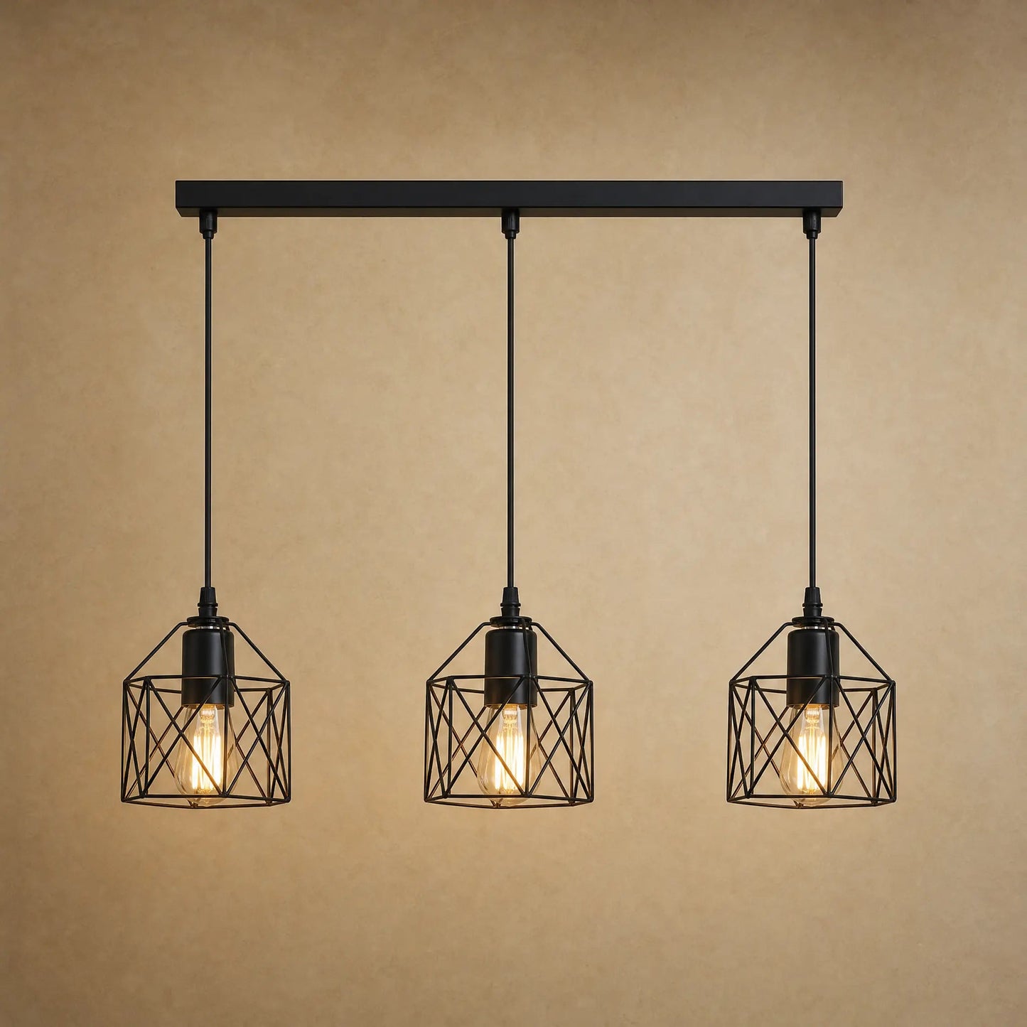 Ullin kitchen pendant light, trio of black iron cages, beige mineral backdrop | Wickleigh