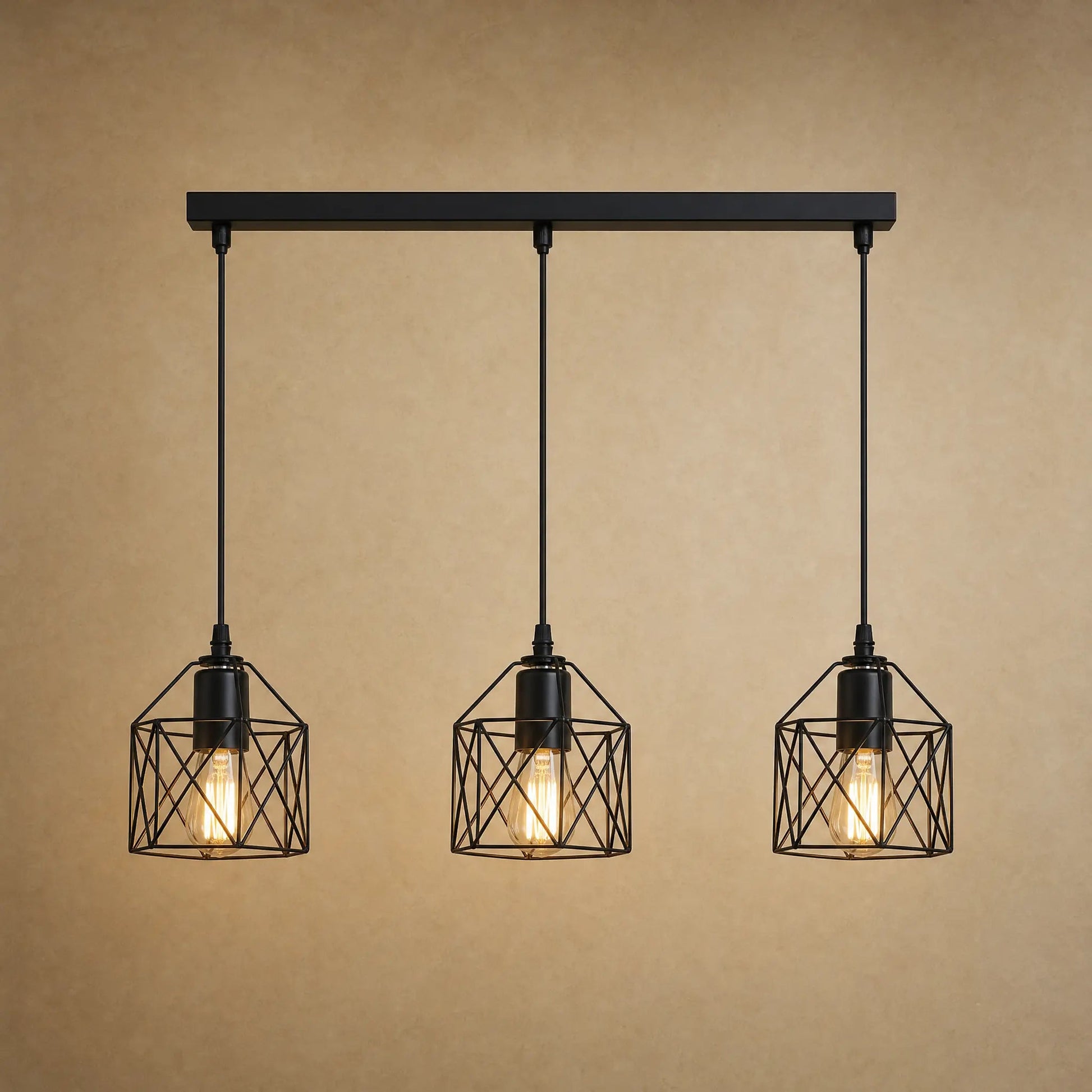 Ullin kitchen pendant light, trio of black iron cages, beige mineral backdrop | Wickleigh