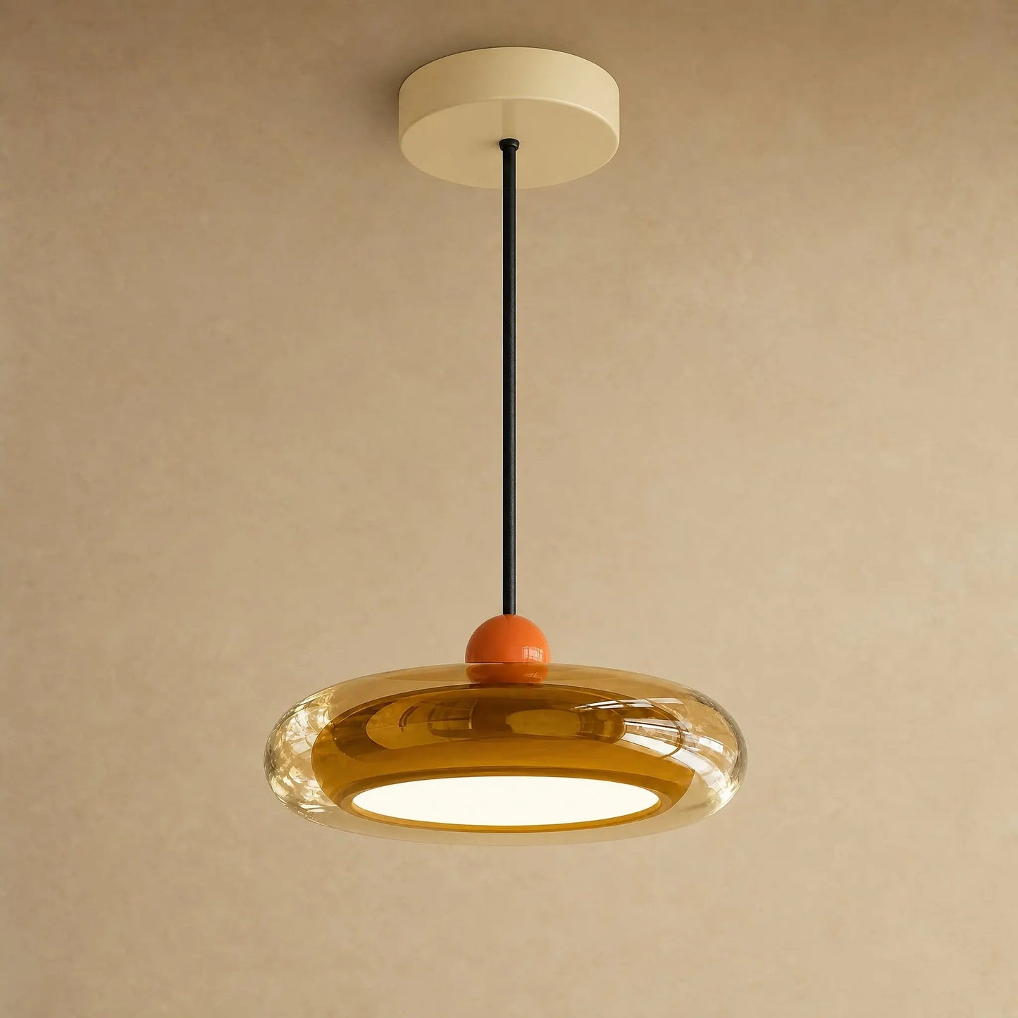 Aswyn pendant light in amber glass with cream base plate | Wickleigh