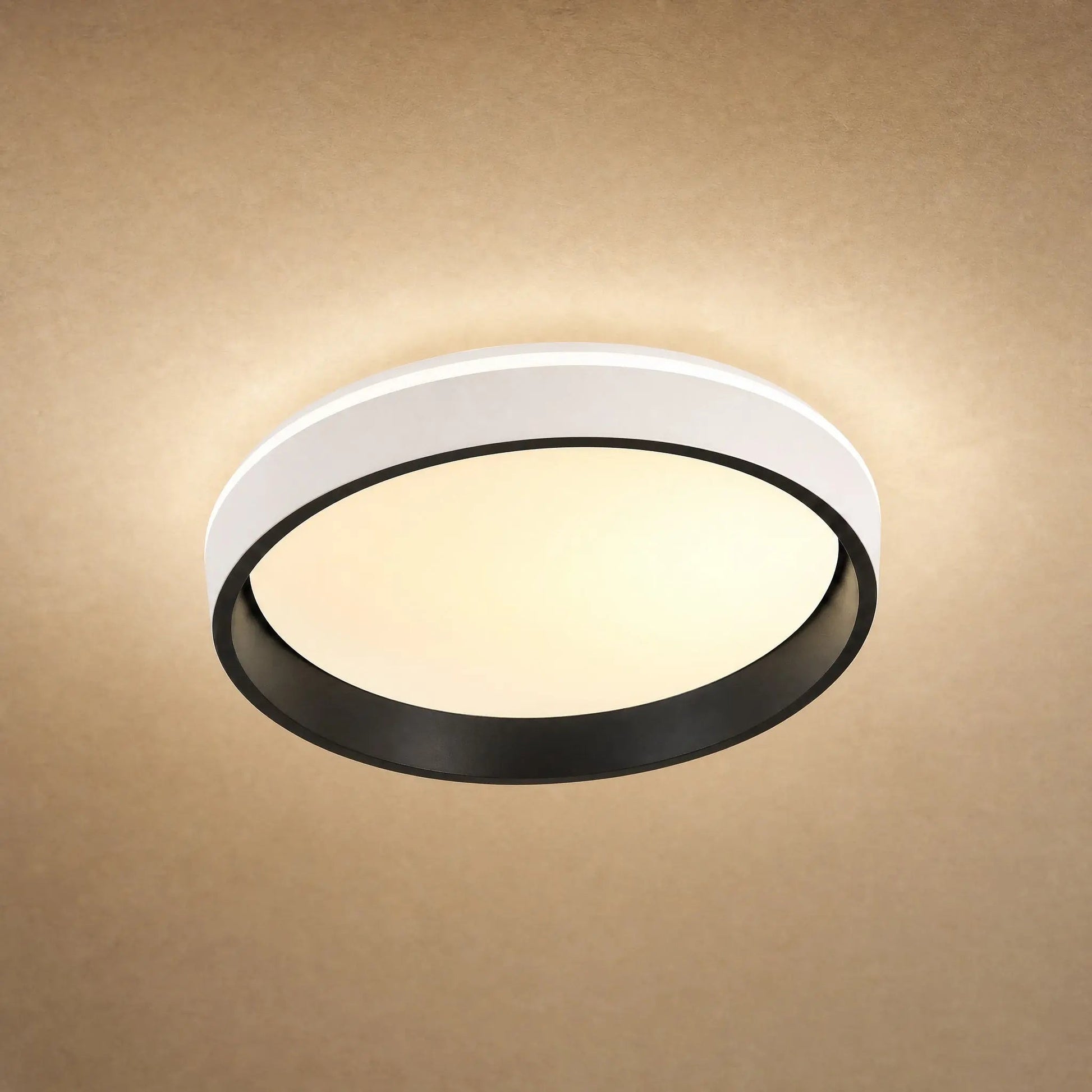 Kyrra ceiling light lit in warm white against a mineral backdrop | Wickleigh
