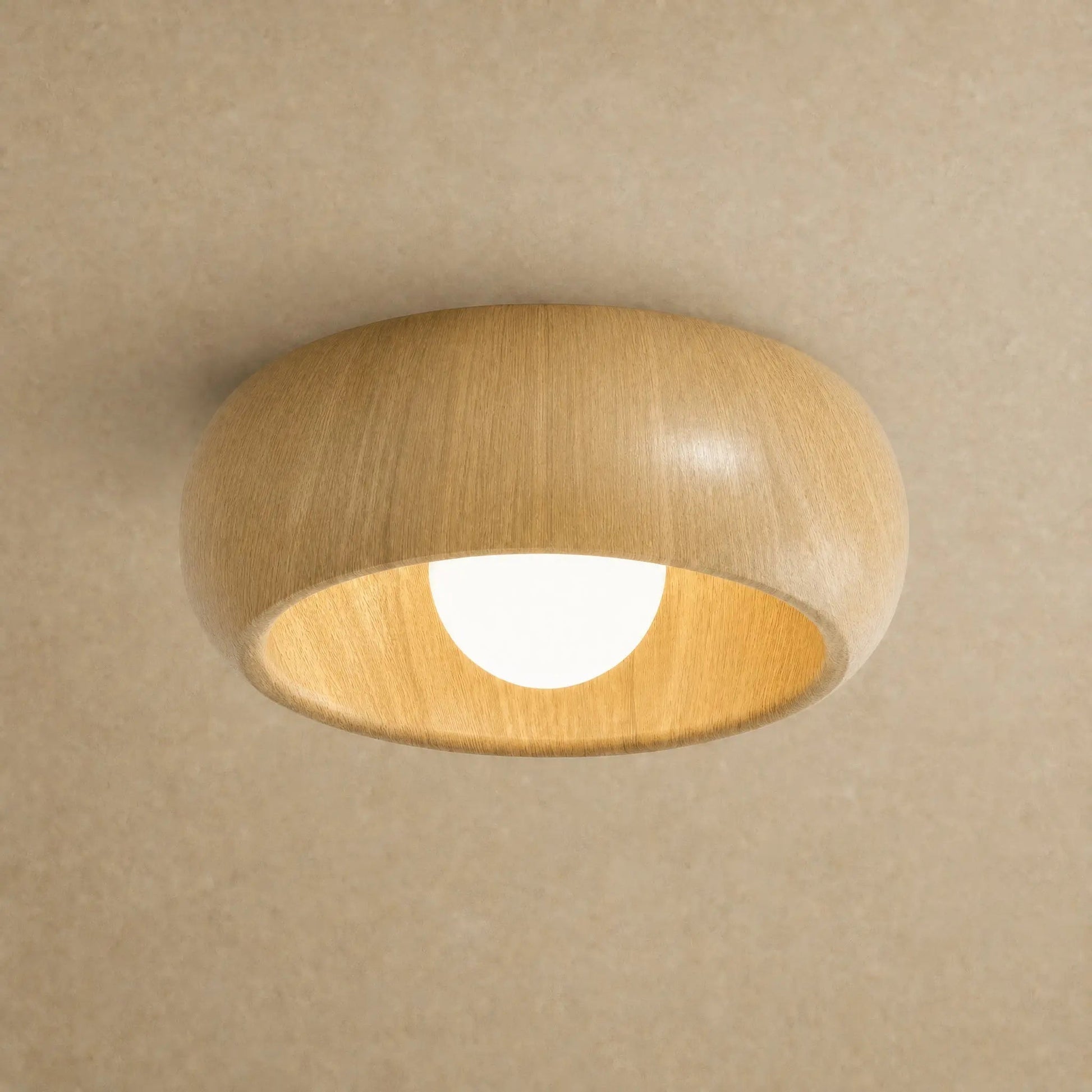 Pelna vintage flush ceiling light in Light Oak finish, wood grain curve, packshot | Wickleigh
