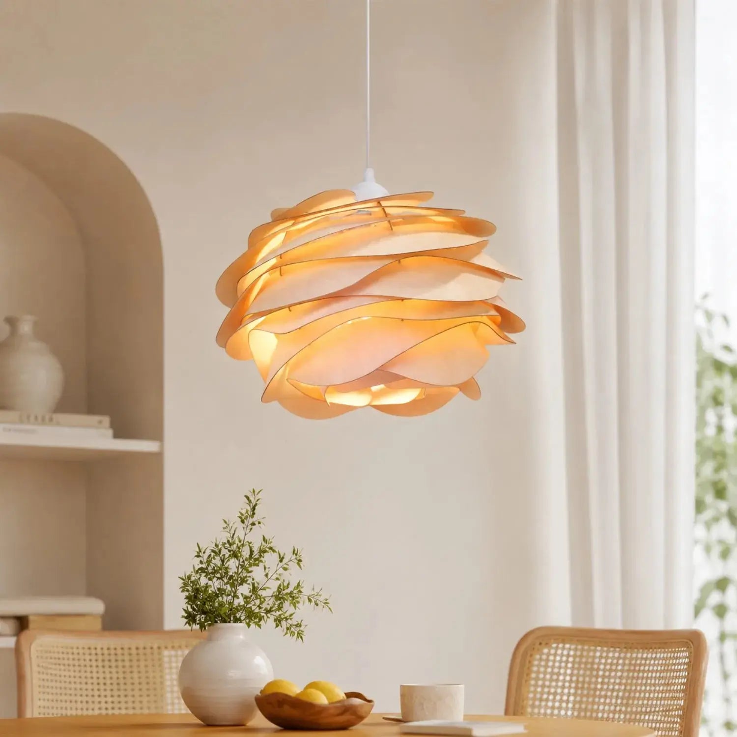 Real life photo of the Henlin sculpted wood pendant light, rose bloom shape, above a table | Wickleigh