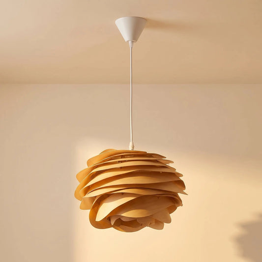 Henlin sculpted wood pendant light, rose bloom shape, on a warm beige background | Wickleigh
