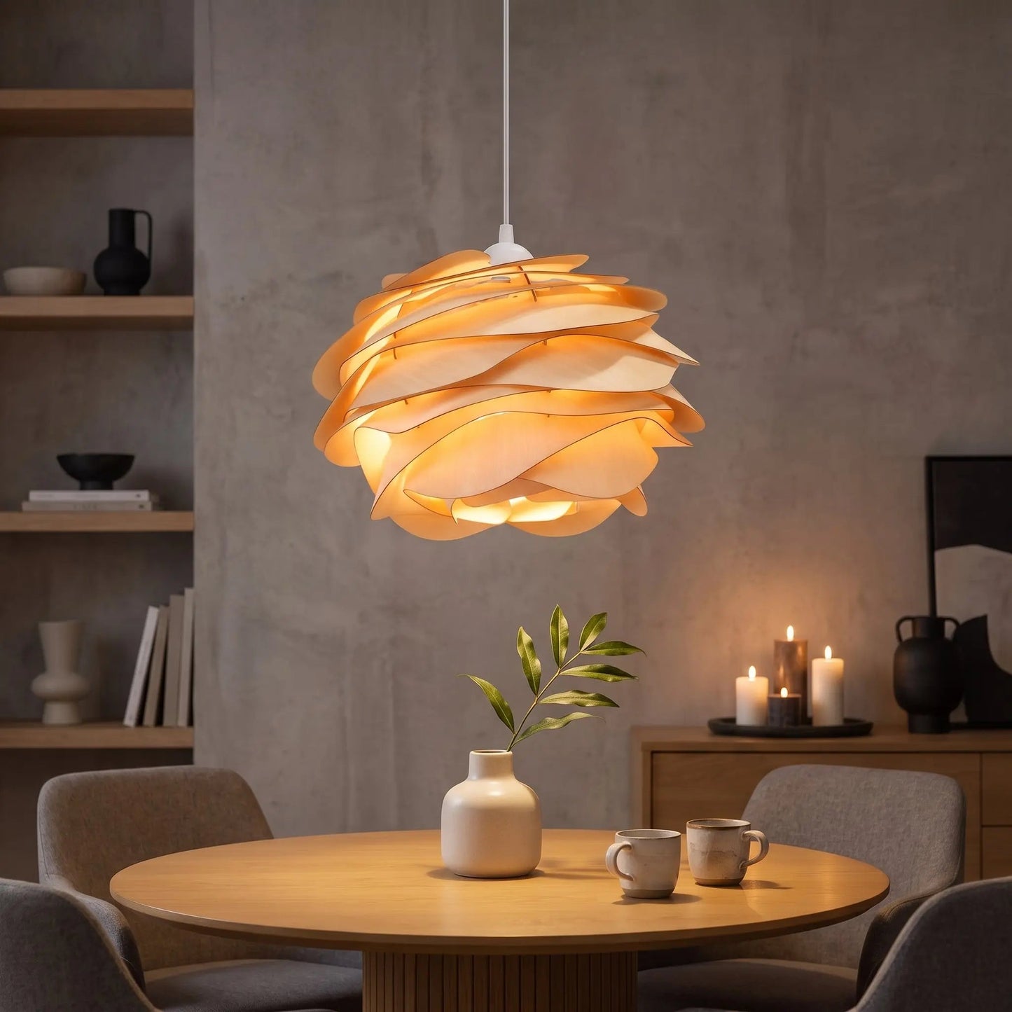 Henlin sculpted wood pendant light lit above a Japandi dining table | Wickleigh