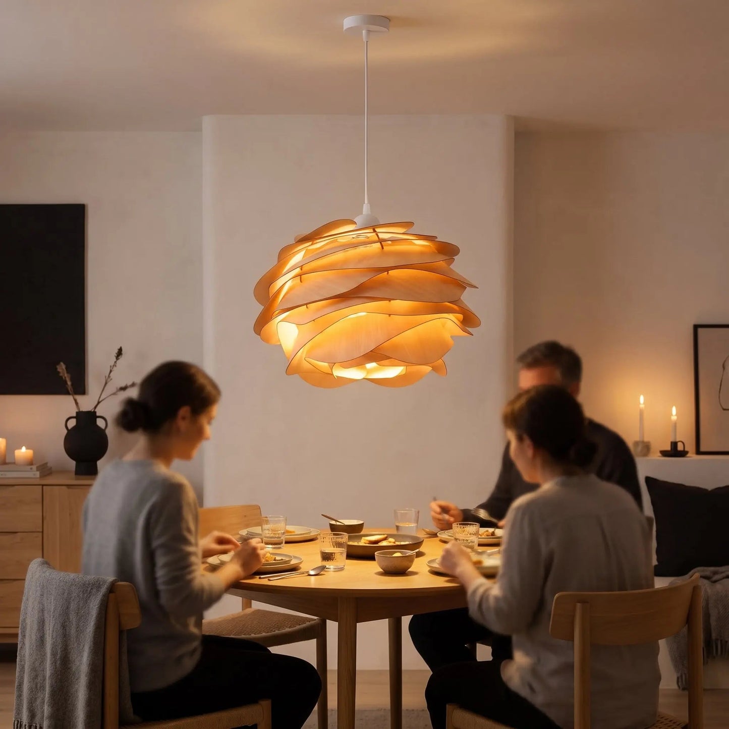 Dinner under the Henlin sculpted wood pendant light in a warm dining room | Wickleigh