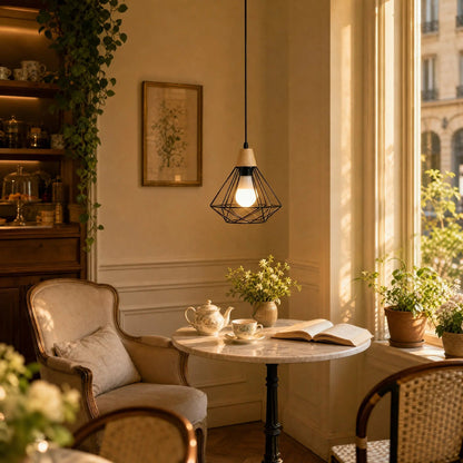 Fyrra diamond cage pendant light, single head, lit in a cosy tea room at golden hour | Wickleigh