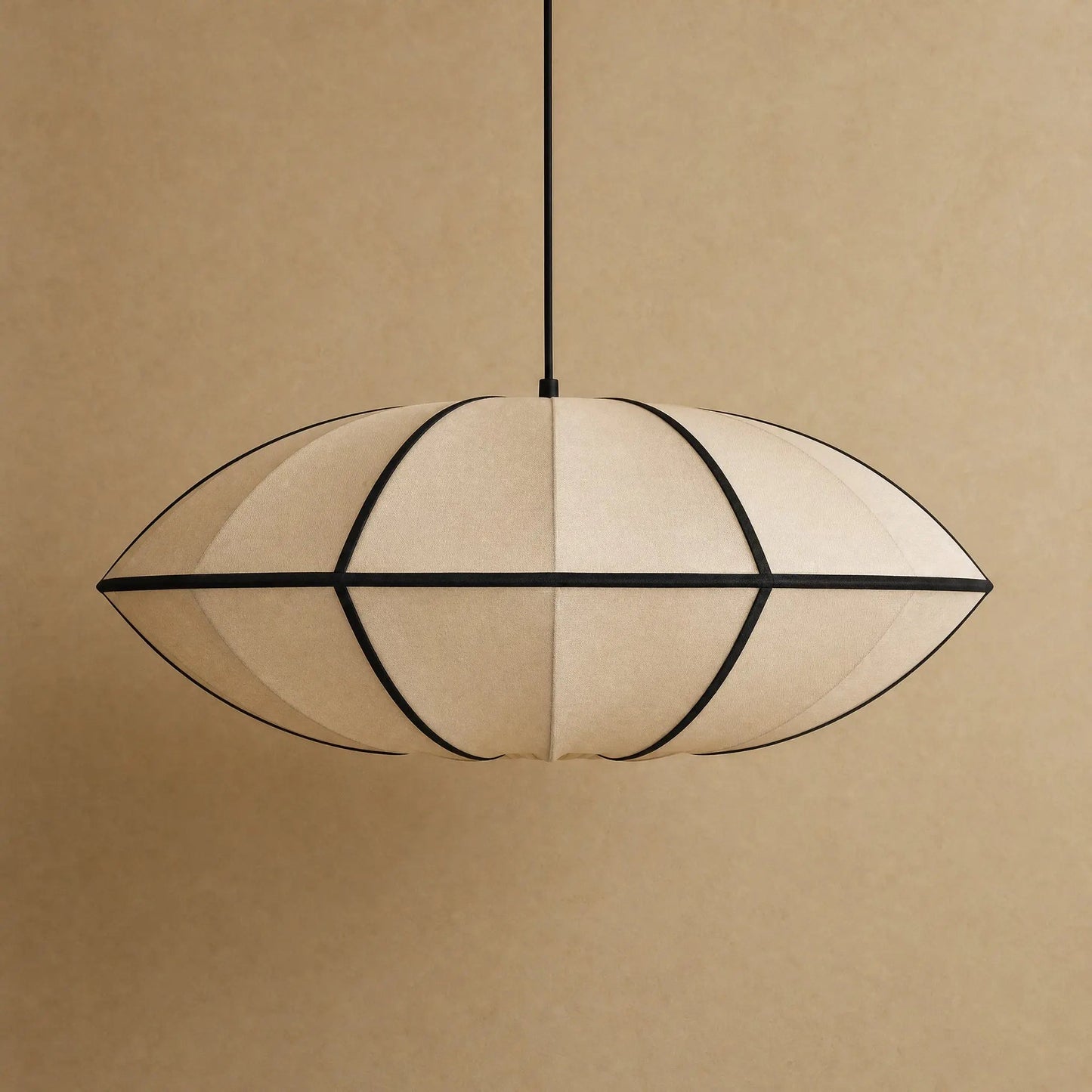 Arnell Japanese silk pendant light, Beige Saucer model, packshot on a warm mineral backdrop | Wickleigh