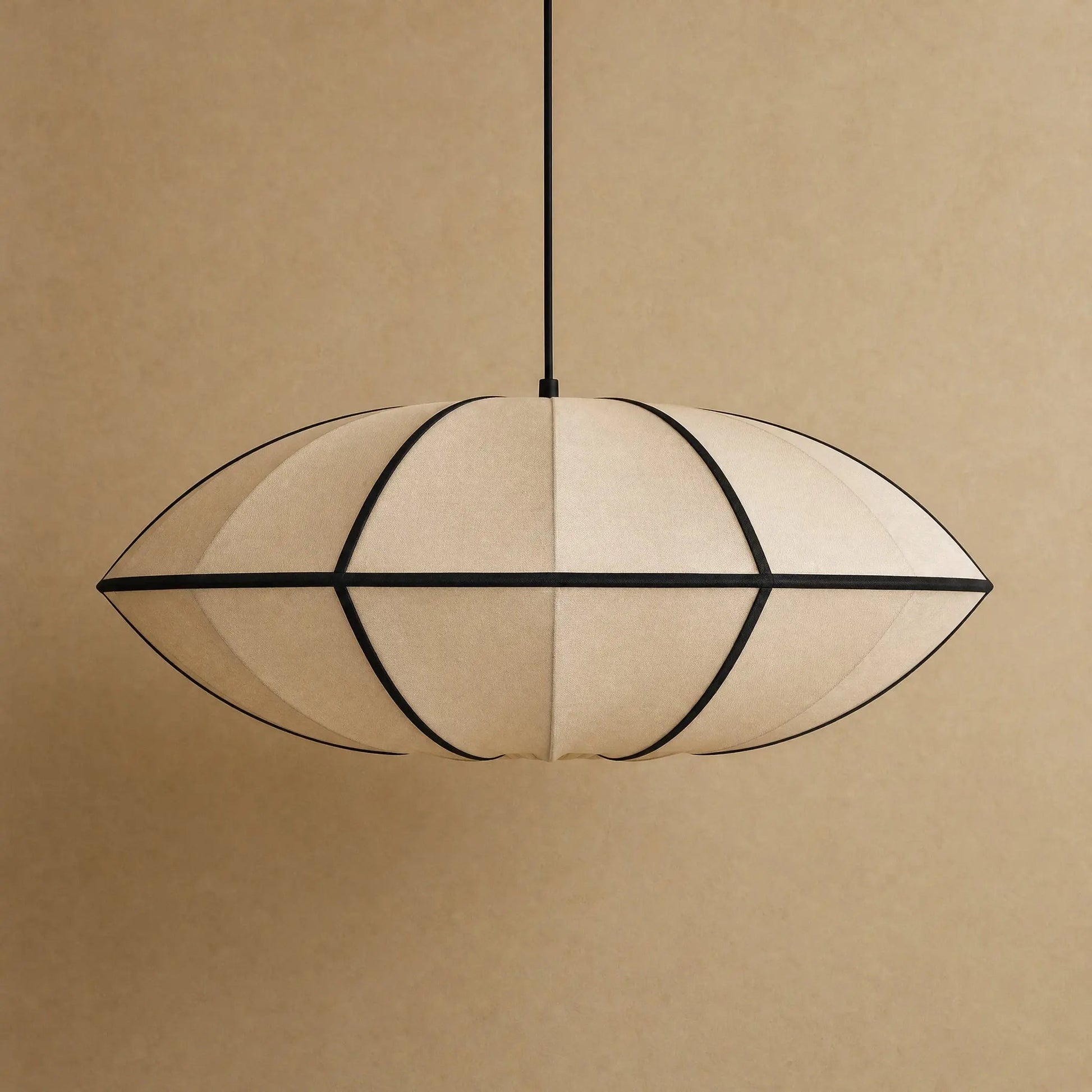 Arnell Japanese silk pendant light, Beige Saucer model, packshot on a warm mineral backdrop | Wickleigh