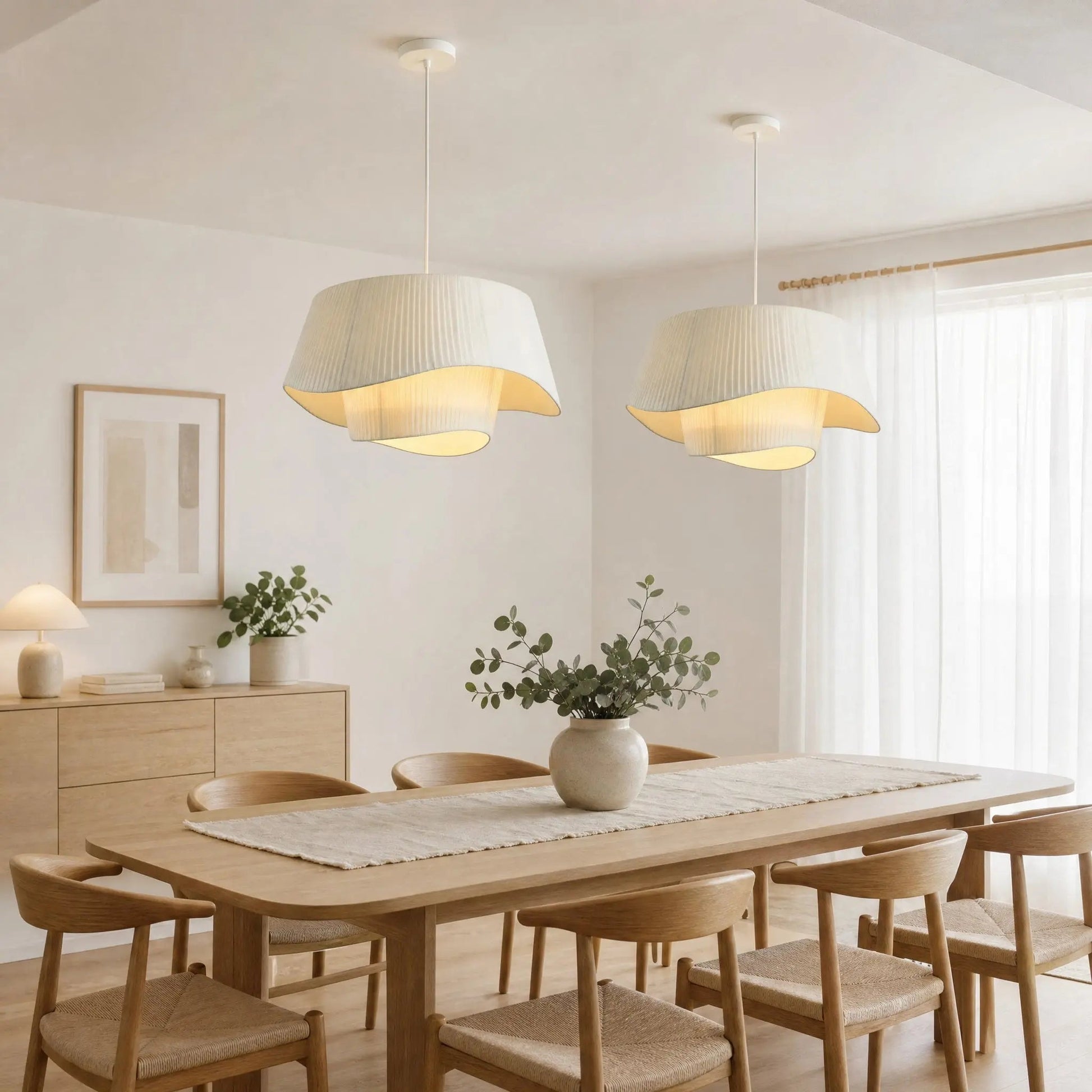 Two Havin linen pendant lights above a light-toned dining table | Wickleigh