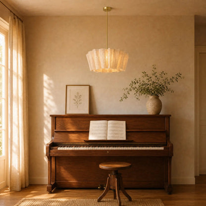 Kelen pendant light on a gold rod, Ø 50 cm, lit above an upright piano | Wickleigh