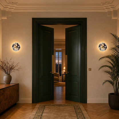 Pair of Belna Art Deco wall lights flanking a bottle green lacquered double door | Wickleigh