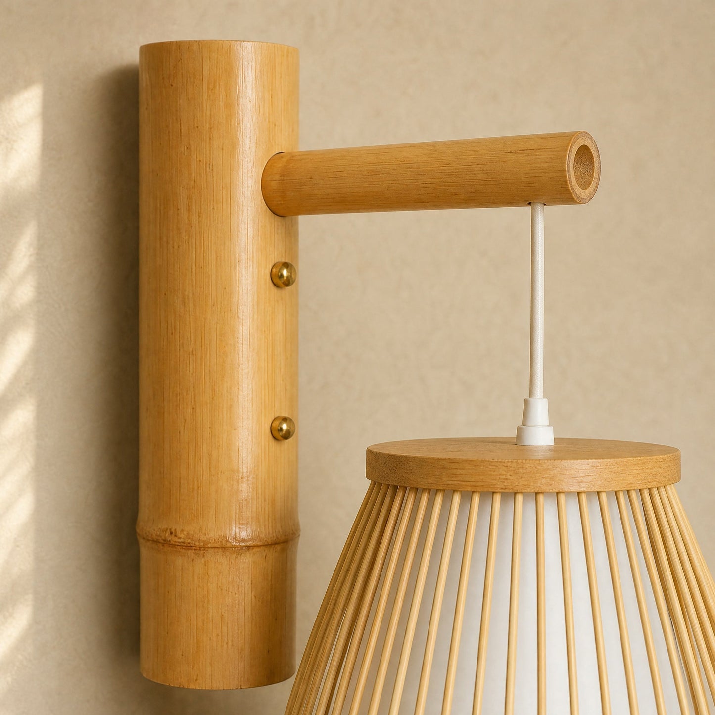 Detail of the hand-woven bamboo and open-cut arm of the Halna wall light | Wickleigh