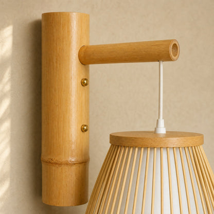 Detail of the hand-woven bamboo and open-cut arm of the Halna wall light | Wickleigh