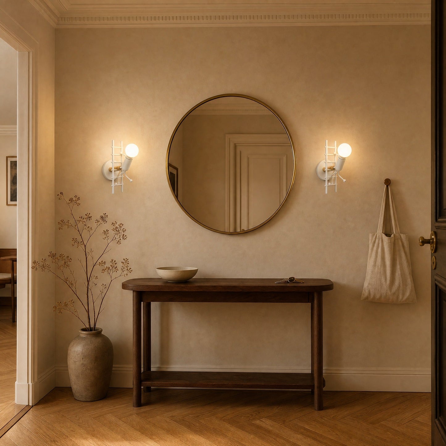 Two Birna white wall lights lit either side of a round mirror in a hallway | Wickleigh