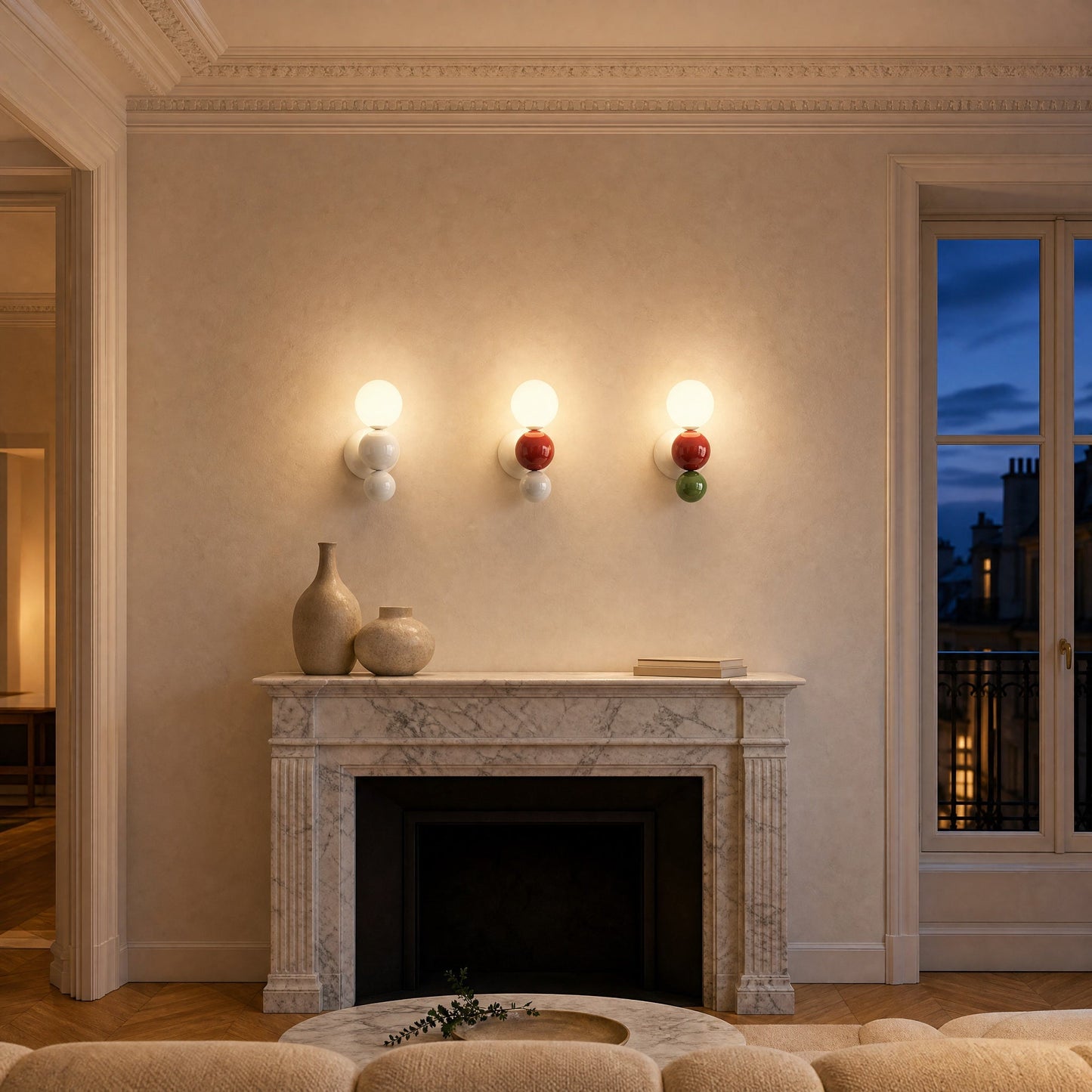 Three Brelin ball wall lights lit in a row above a marble fireplace | Wickleigh