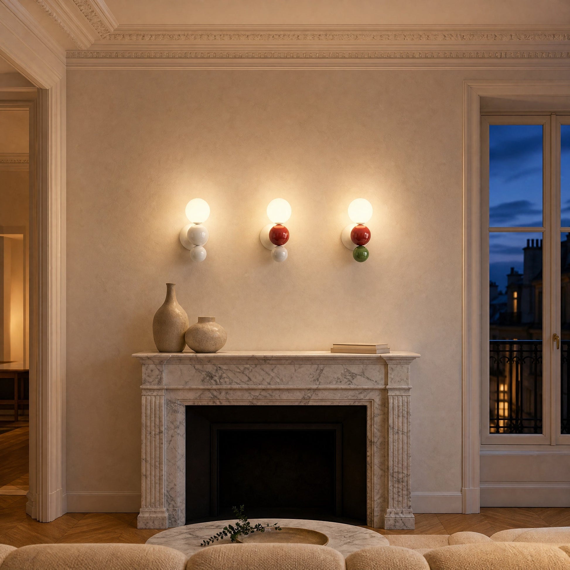 Three Brelin ball wall lights lit in a row above a marble fireplace | Wickleigh