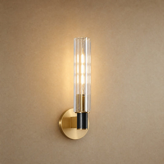 Calin single-light wall light, fluted glass column on a brushed brass disc | Wickleigh