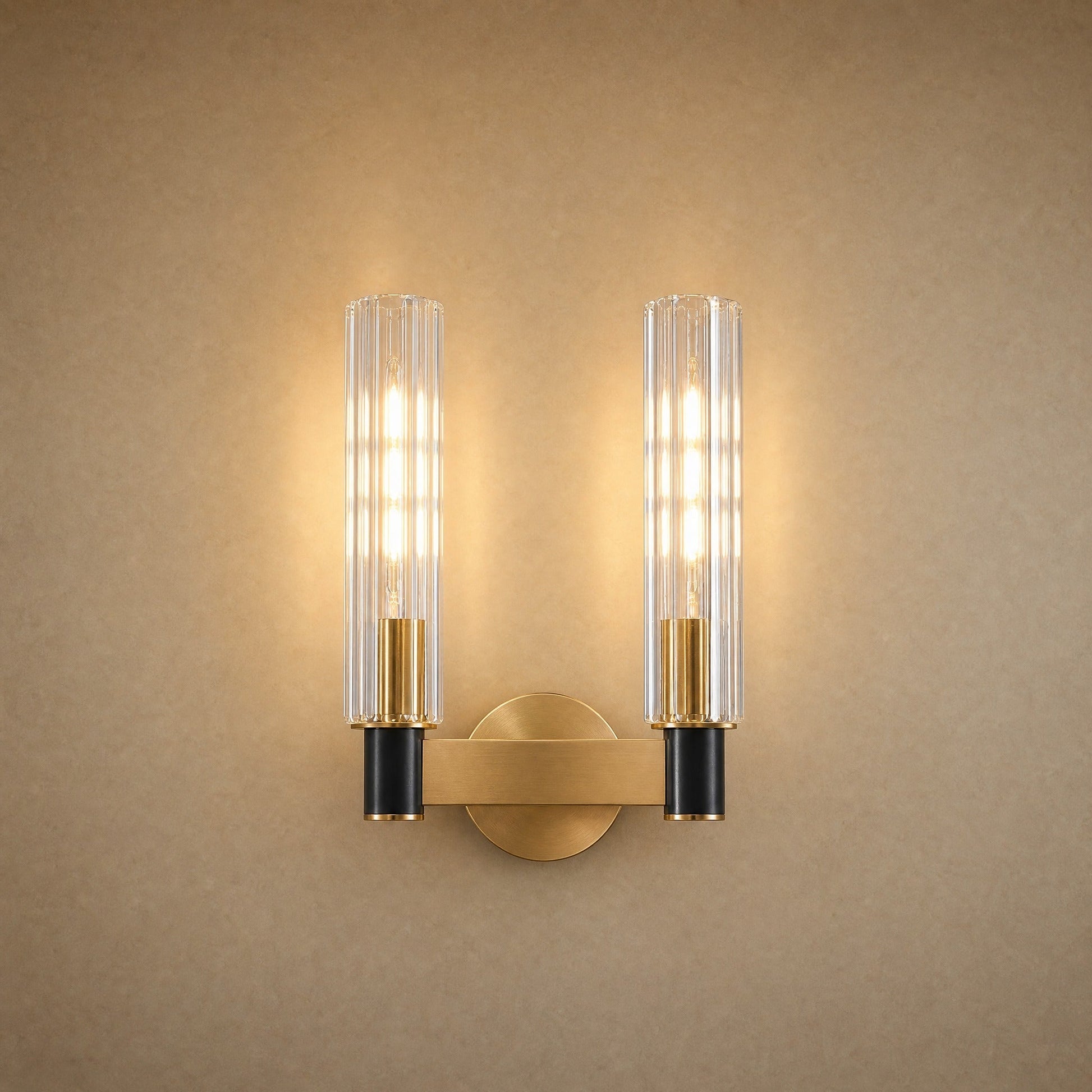 Calin double-light wall light, two fluted glass columns on a brass bar | Wickleigh