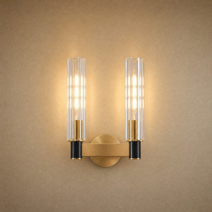 Calin double-light wall light, two fluted glass columns on a brass bar | Wickleigh