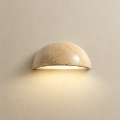 Calvra half-moon wall light lit, natural travertine dome Ø 15 cm | Wickleigh