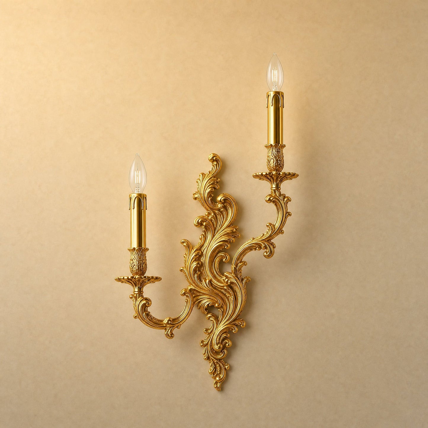 Cerna gold candle wall light, two-candle rococo design, packshot on sand background | Wickleigh