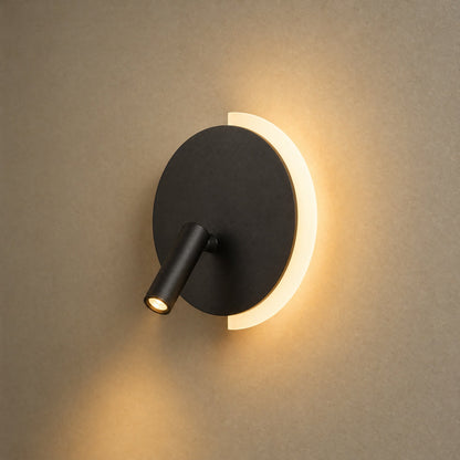 Clenna black dual-light wall light lit, glowing crescent and pivoting spot | Wickleigh